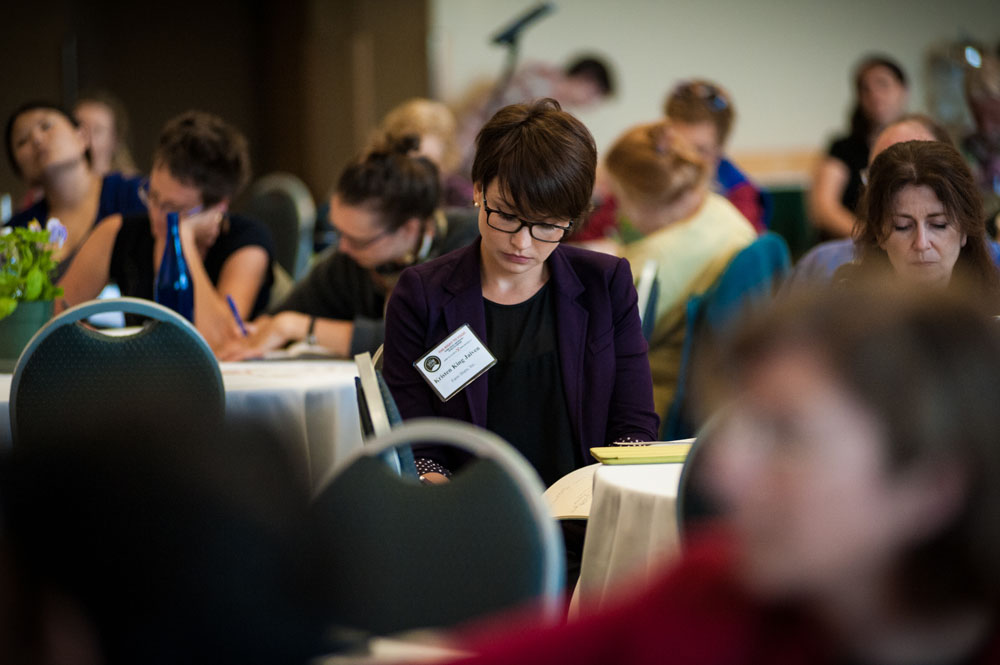Participants take notes during a session