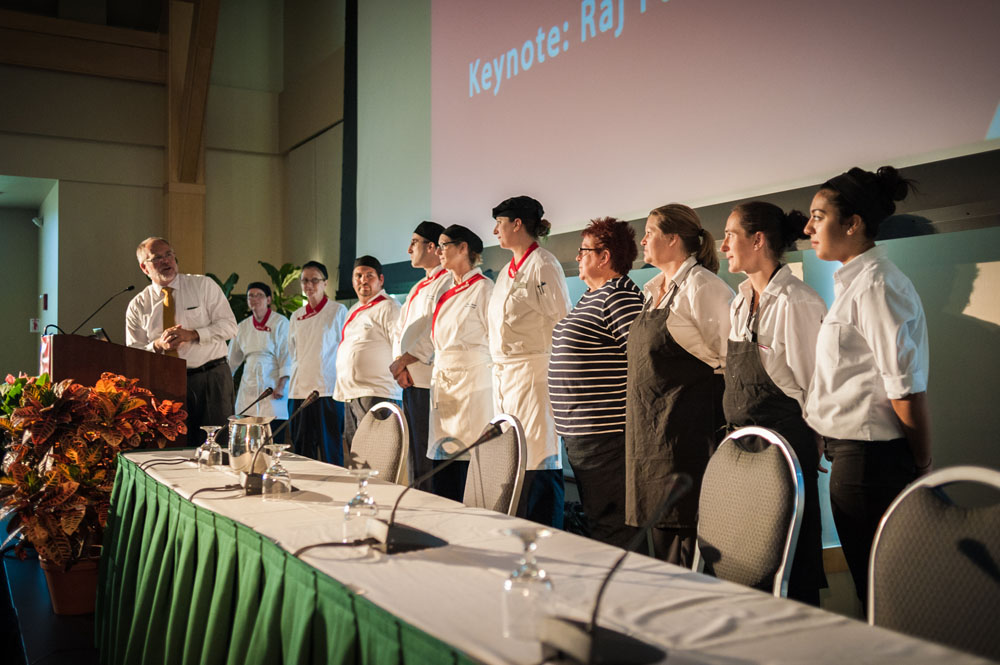 UVM Catering staff take the stage as Summit participants applaud the delicious food provided during the Summit