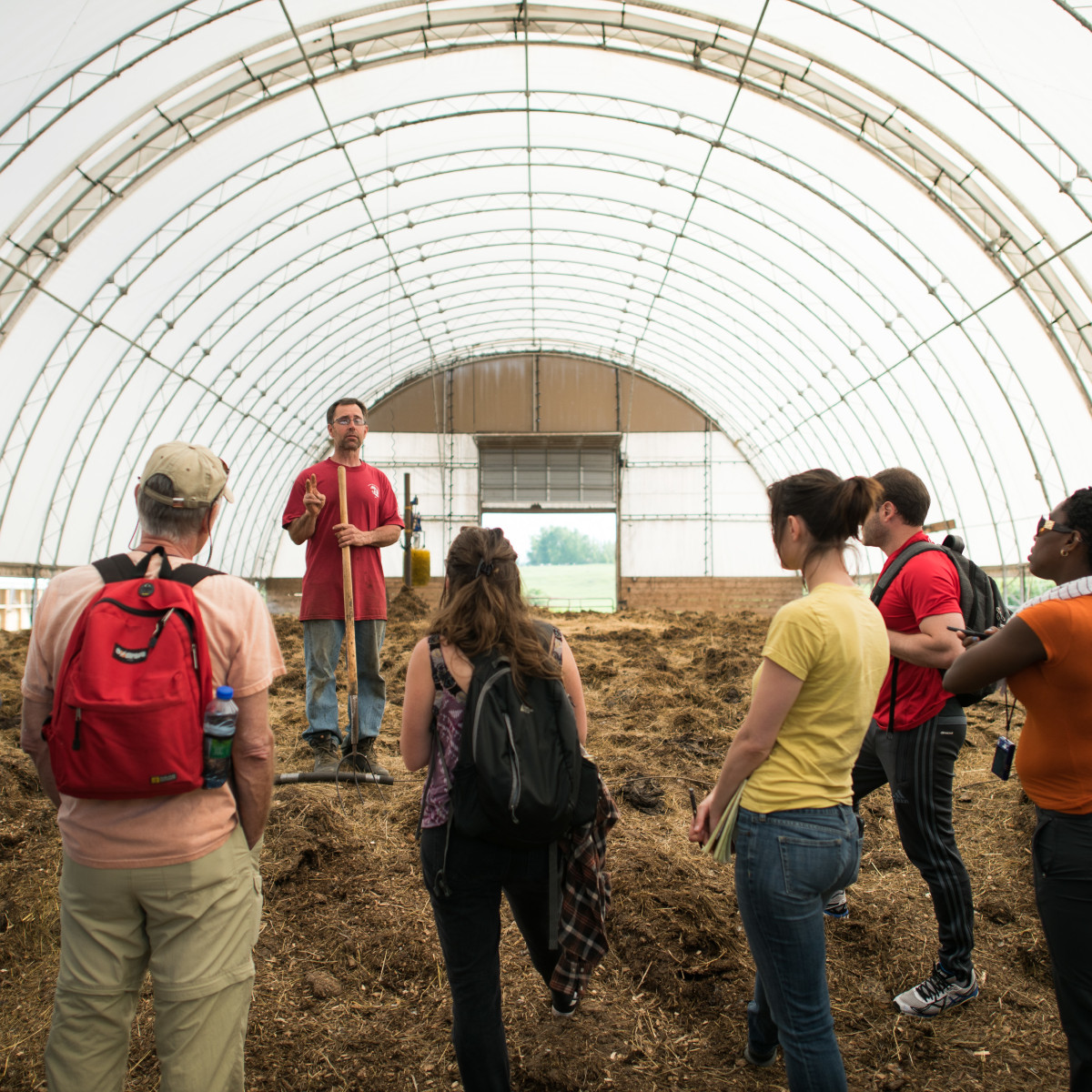 Students in hoop house on farm
