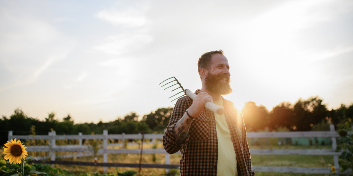 farmer with pitchfork sunset