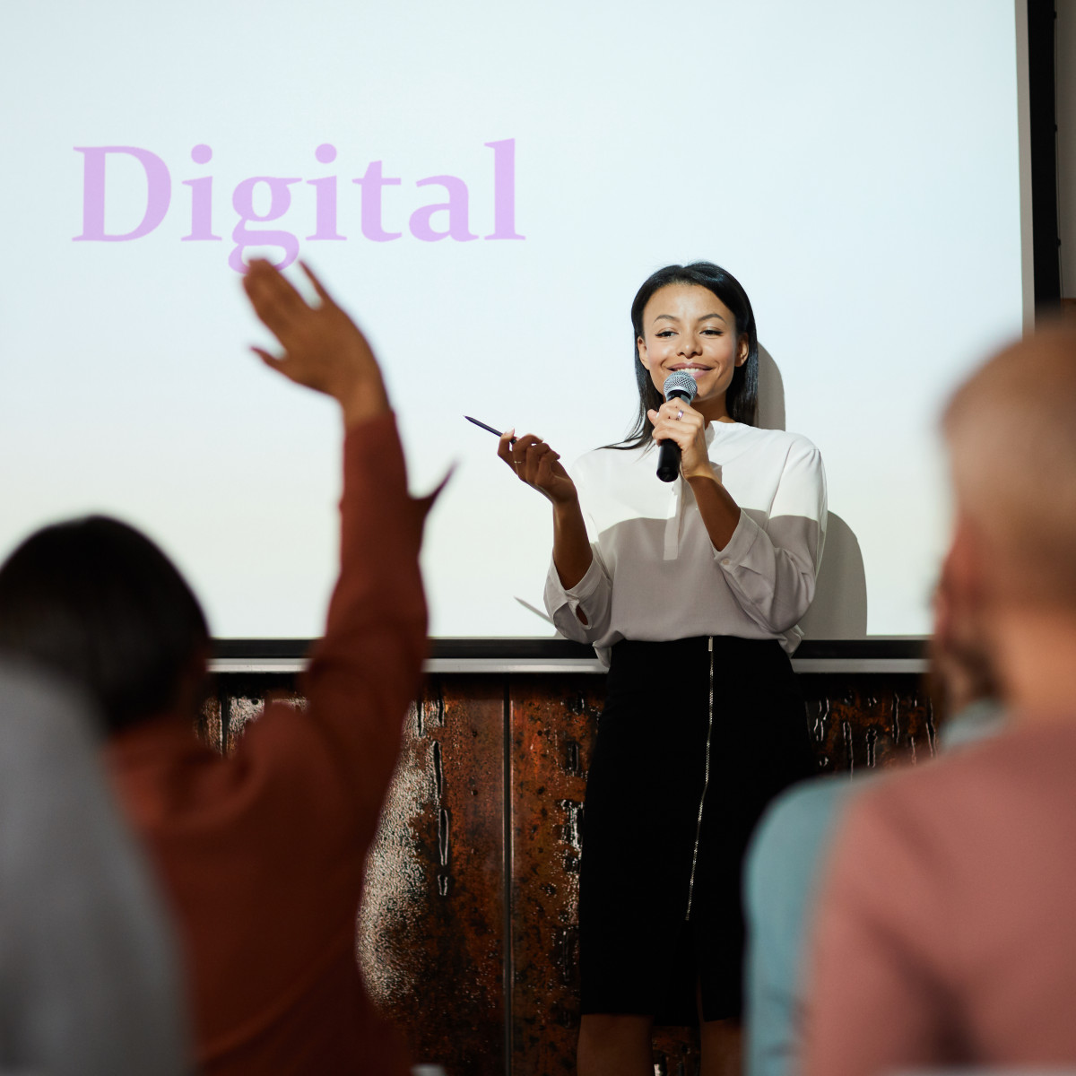 woman presenting digital to a group