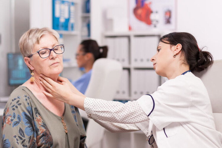 SLP checking on a patient