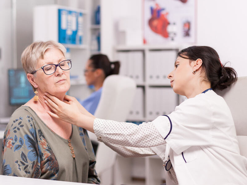 SLP checking on a patient