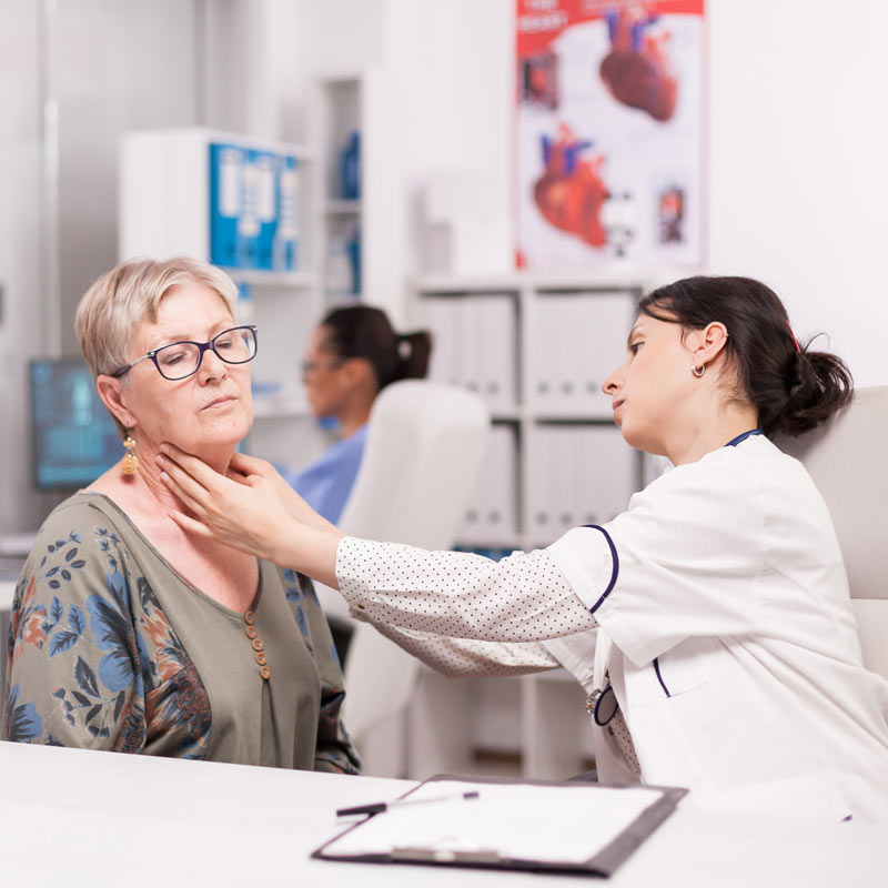 SLP checking on a patient