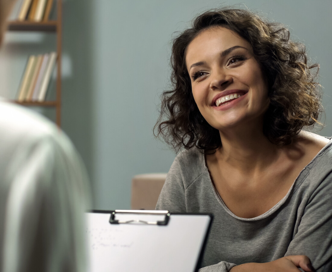 woman smiling during therapy session