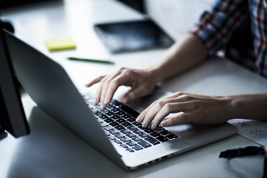 Typing on laptop
