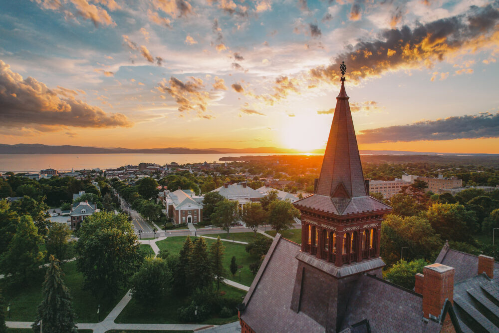 UVM campus with sunset and lake Champlain