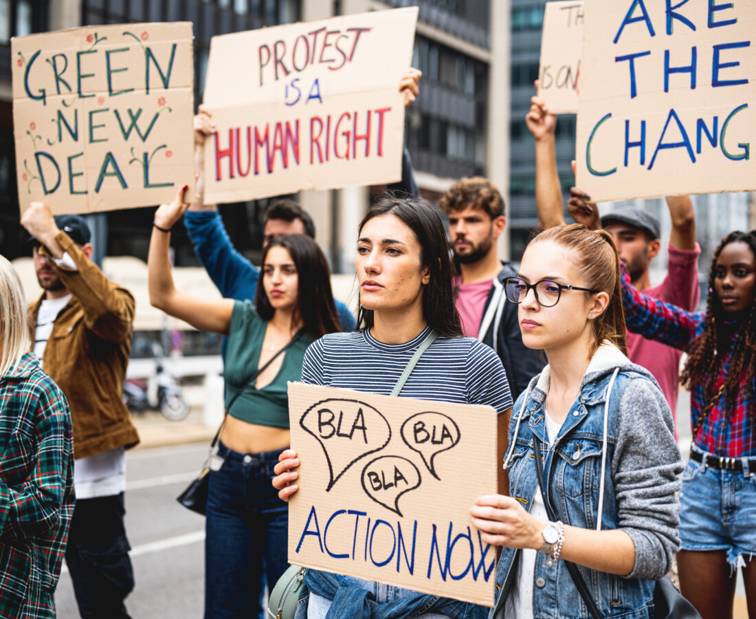 Group of students protesting climate change on college campus.