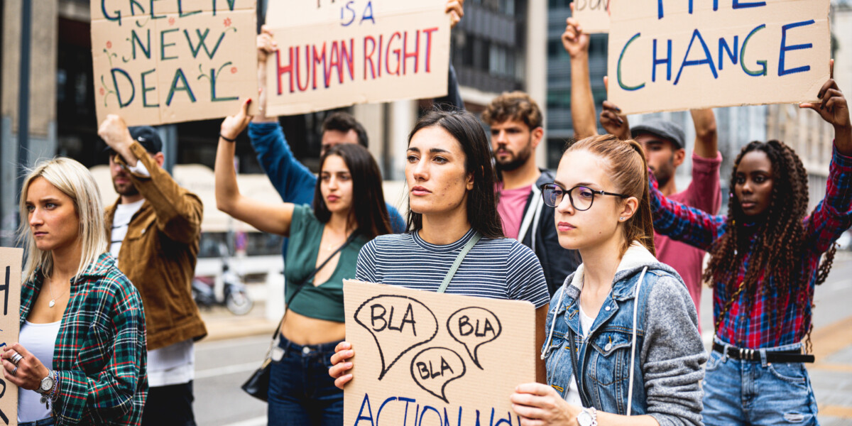 Group of students protesting climate change on college campus.