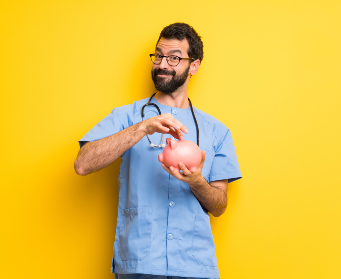medical professional happy with a full piggy bank post bacc scholarship
