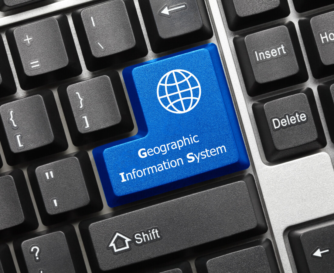 Close-up view on conceptual keyboard - Geographic Information Sysytem (blue key)