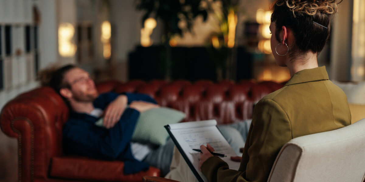 Patient on a couch speaking to a therapist
