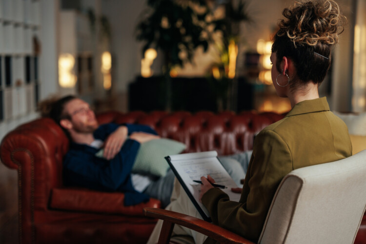 Patient on a couch speaking to a therapist