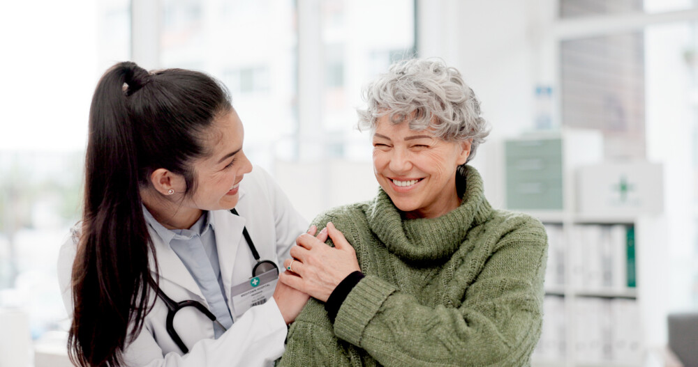 Doctor with a person for medical healthcare consultation at a clinic