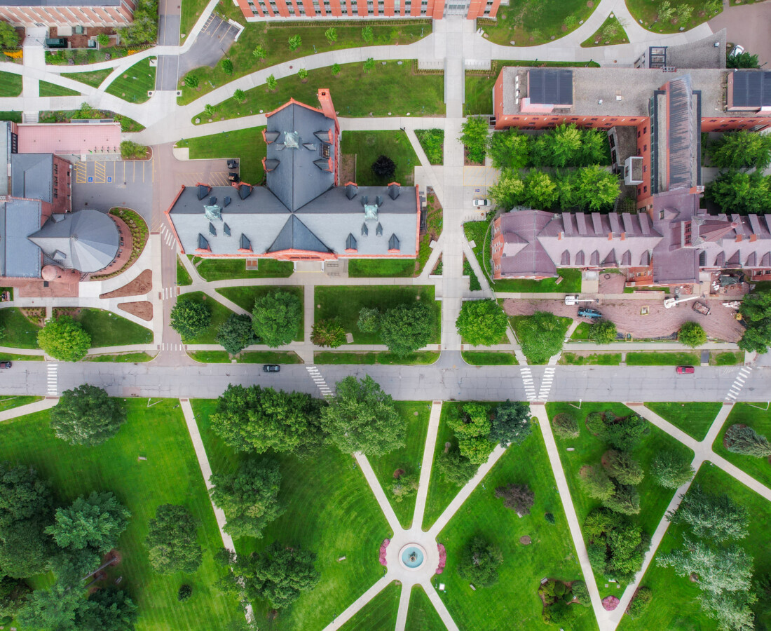 Drone view over University of Vermont campus showing buildings, sidewalks, and street. For Remote Sensing course.