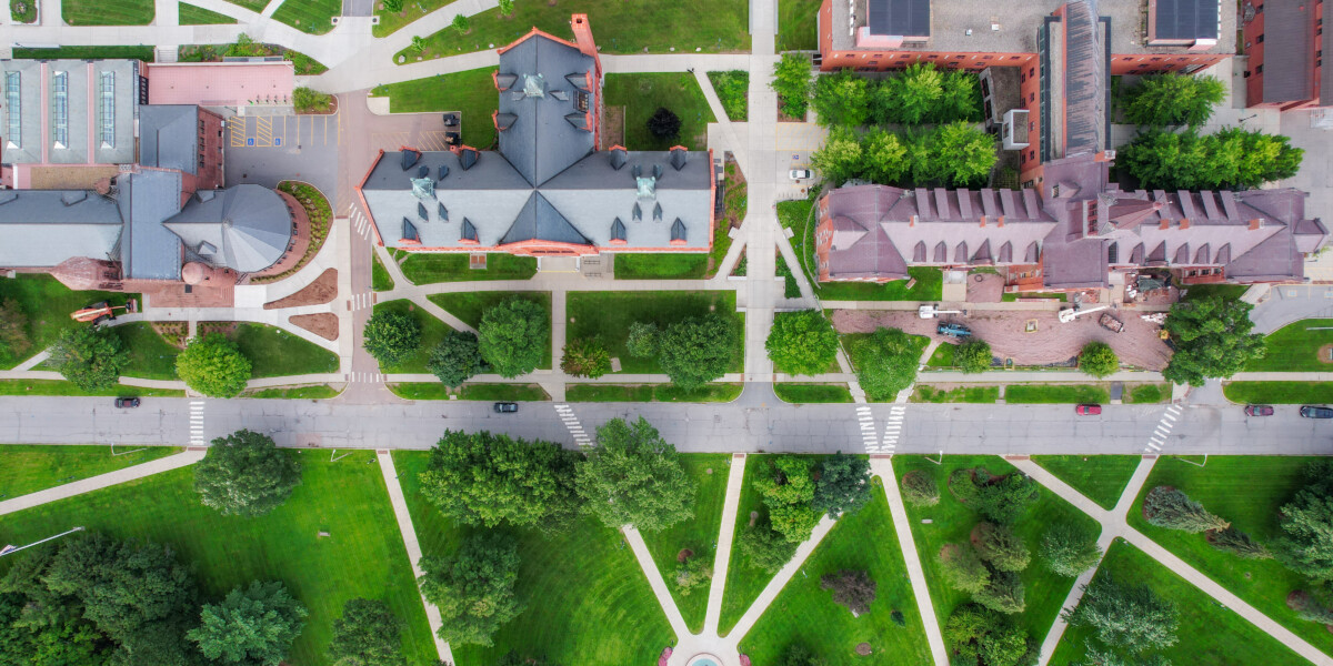 Drone view over University of Vermont campus showing buildings, sidewalks, and street. For Remote Sensing course.