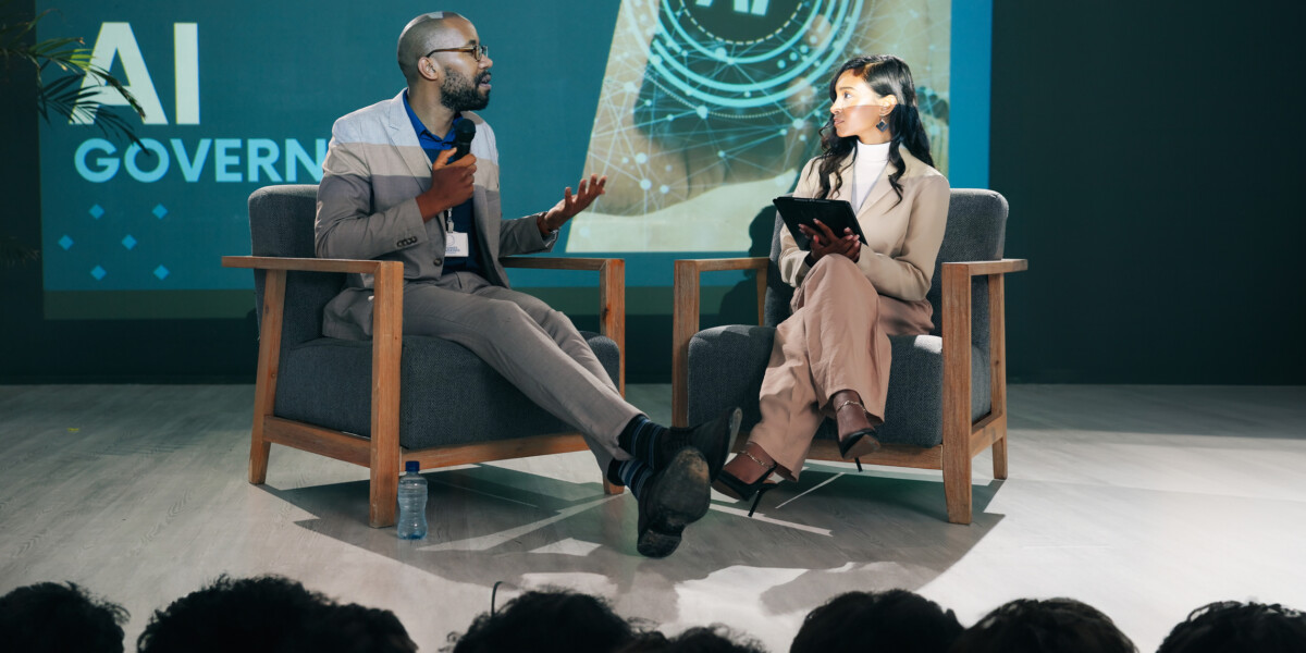 Event presentation and people with mic on stage for future development AI seminar