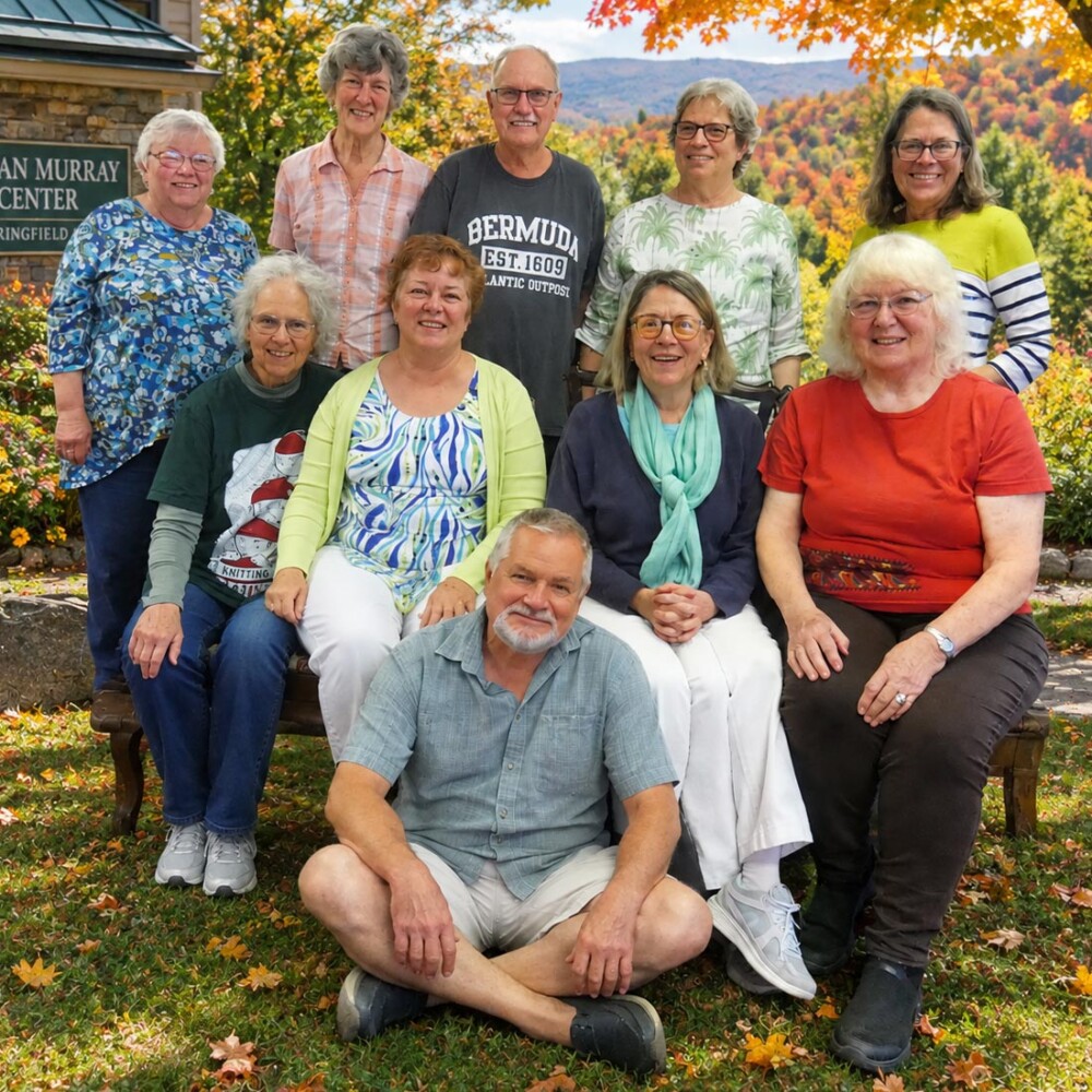 UVM OLLI committee members smiling and posing in Springfield, VT